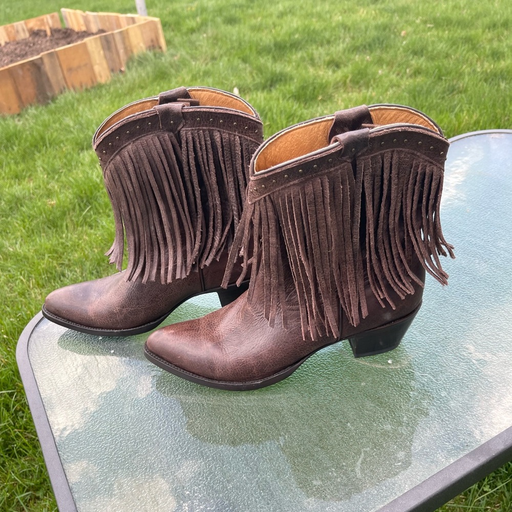 Brown leather cowgirls boots with tassels